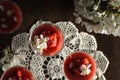 Panna cotta in a cup with fresh strawberry on the top and cherry blosoms Royalty Free Stock Photo