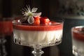 Panna cotta in a cup with fresh strawberry on the top and cherry blosoms Royalty Free Stock Photo