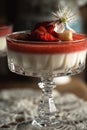 Panna cotta in a cup with fresh strawberry on the top and cherry blosoms Royalty Free Stock Photo