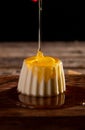 Panna Cotta on a wood surface with honey drizzle Royalty Free Stock Photo