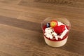 Pannacotta with Berries on wooden table, side view, custard and Jelly, wood background.