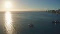 Panning aerial drone slowly flying over a colorful Honolulu Skyline while Sunset in Oahu, Hawaii with Waikiki Beach Royalty Free Stock Photo