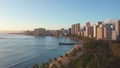 Panning aerial drone slowly flying over a colorful Honolulu Skyline while Sunset in Oahu, Hawaii with Waikiki Beach Royalty Free Stock Photo