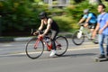 Panning of biker and skater in the street