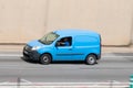 Panning of blue van, Renault Kangoo brand along Barcelona's Ronda Litoral