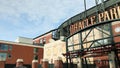 panning footage of the ODoul Gate at Oracle Park and McCovey Cove with people walking, blue ocean water, blue sky and clouds