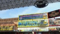 panning footage of Tacos and Miches, the Souvenir Supermart, 322 Pizza Bar with people walking at the Fremont Street Experience