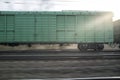 Panning of a freight train on the railway at sunset Royalty Free Stock Photo