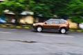 Panning photography shot of a unknown car on the road shhot on nikon d5300 no external gears used