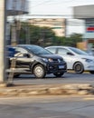 Panning shot of black and white cars in the state of Minas Gerais in Belo Horizonte, Brazil