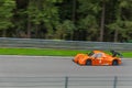 Panning shot of orange Radical RXC Royalty Free Stock Photo