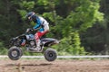 Panning side shot of quad rider jumping in the race Royalty Free Stock Photo