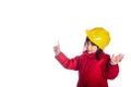 Pannoramic 4 year old girl smiling pointing a finger up towards a blank space with a yellow construction helmet looking at camera