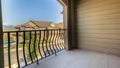 Pano Balcony of home overlooking houses and mountain against blue sky on a sunny day Royalty Free Stock Photo