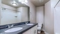 Pano Bathroom with bathtub in front of vanity area with double oval sink and mirror Royalty Free Stock Photo