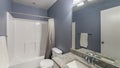 Pano Bathroom interior with lights and purple gray wall paint Royalty Free Stock Photo