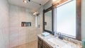 Pano Bathroom interior with tile walls, warm lightnings and sliding window panel with mirror Royalty Free Stock Photo