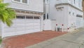 Pano Beautiful homes exterior in Long Beach California with glass paned garage doors