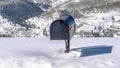 Pano Black freestanding residential mailbox against deep snow in Park City Utah