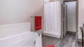 Pano Clean bathroom with shower stall bathtub and vanity area with bright lights Royalty Free Stock Photo