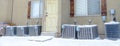 Pano Exterior of apartment with air conditioning units by the white wooden door