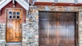 Pano Front door and attached garage of home with red siding and brick exterior wall