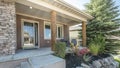 Pano Front exterior of a house with a raised edge landscape and stone brick walls