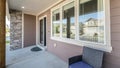 Pano Front exterior of a house with windows, door and stone brick wall