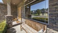 Pano Front porch exterior of a house with stone bricks and wooden bench