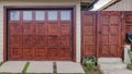 Pano Home in San Diego California with glass paned garage door beside wooden gate