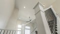 Pano House interior with a view of a staircase and window