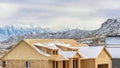 Pano House under construction in Utah Valley against snowy mountain and cloudy sky