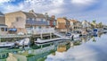 Pano Huntington Beach California scenery with homes overlooking the road and canal