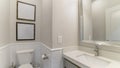 Pano Interior of a bathroom with built-in sink with cabinet and mirror Royalty Free Stock Photo