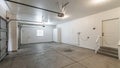 Pano Interior of a garage with double automatic doors and concrete floor Royalty Free Stock Photo