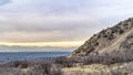 Pano Mountain and sea with beautiful background of overcast sky and golden sunset