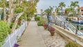 Pano Pathway along a canal with docks and leisure boats in Long Beach California