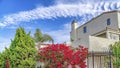 Pano Plants and flowers against fence of house with iron gate in Huntington Beach CA Royalty Free Stock Photo