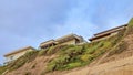 Pano San Diego California mountain with homes against blue sky and clouds background Royalty Free Stock Photo