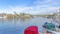 Pano Serene sea reflecting blue sky in scenic Huntington Beach with waterfront houses Royalty Free Stock Photo