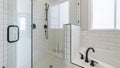 Pano Shower stall with tiles and cohesive plumbing fixtures