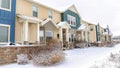 Pano Snowy neighborhood with apartment featuring gables entrances and small porches