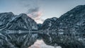 Pano view accross Hallstatt lake of the snowy village during sunset time in winter in Austria Royalty Free Stock Photo