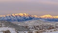 Pano View of Wasatch Mountains at Mount Timpanogos, Eagle Mountain in Utah with brilliant sunlight on top Royalty Free Stock Photo