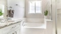 Pano White bathroom with tub, shower stall with glass and vanity cabinet with marble top, sink and mirror