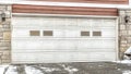 Pano White door with glass panes of a two car garage attached to a house in Utah