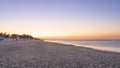 Panorama of adriatic sea and beach with umbrella at sunrise