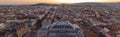 Panorama aerial drone shot of St. Stephen`s Basilica over opera house in Budapest sunrise morning glow