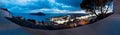 Panorama aerial night view of Dubrovnik, Lokrum Island and ocean with dramatic cloudscape, Croatia