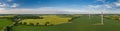 Panorama aerial view of countryside infrastructure windmills, agriculture fields, plant and farm. Royalty Free Stock Photo